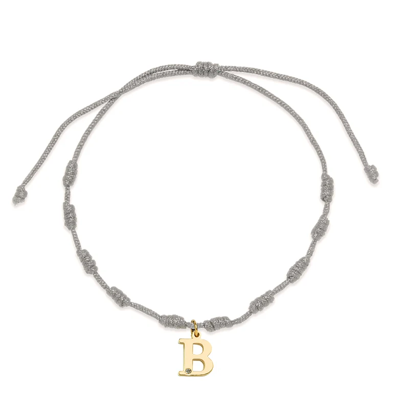 Pulsera Essenza Hilo Nudos Gris con Iniciales en Oro Amarillo 9 Kilates y Diamante